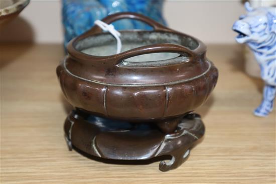A Chinese bronze tripod censer and stand